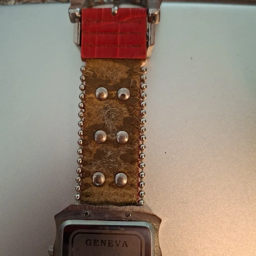 Geneva 92643 Womens Buckle Watch. Red Band, Silvertone,Elephant & Gem Accents.